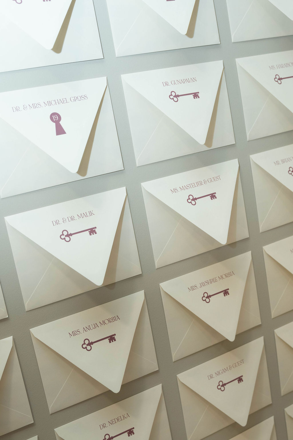 Personalized envelope wall display created for a Virginia Beach grand opening event, featuring custom guest envelopes and interactive experience cards designed by Lustre Theory.